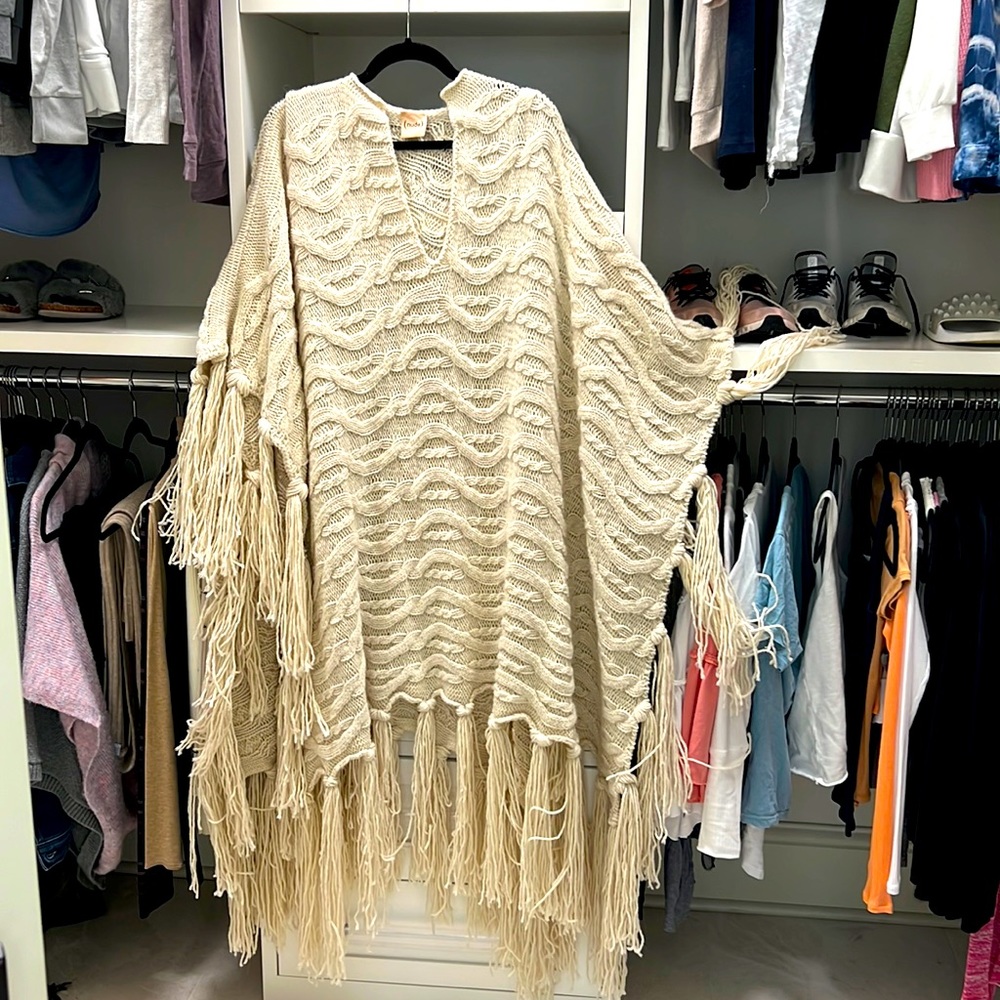 Nude cable knit poncho